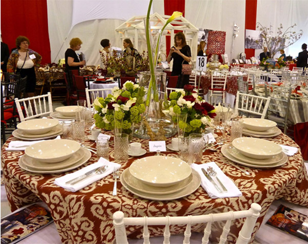 with bold ikat patterned tablecloth and elegant floral centerpiece