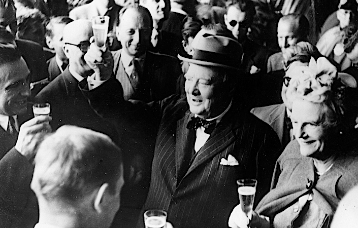 Winston Churchill toasting with champagne