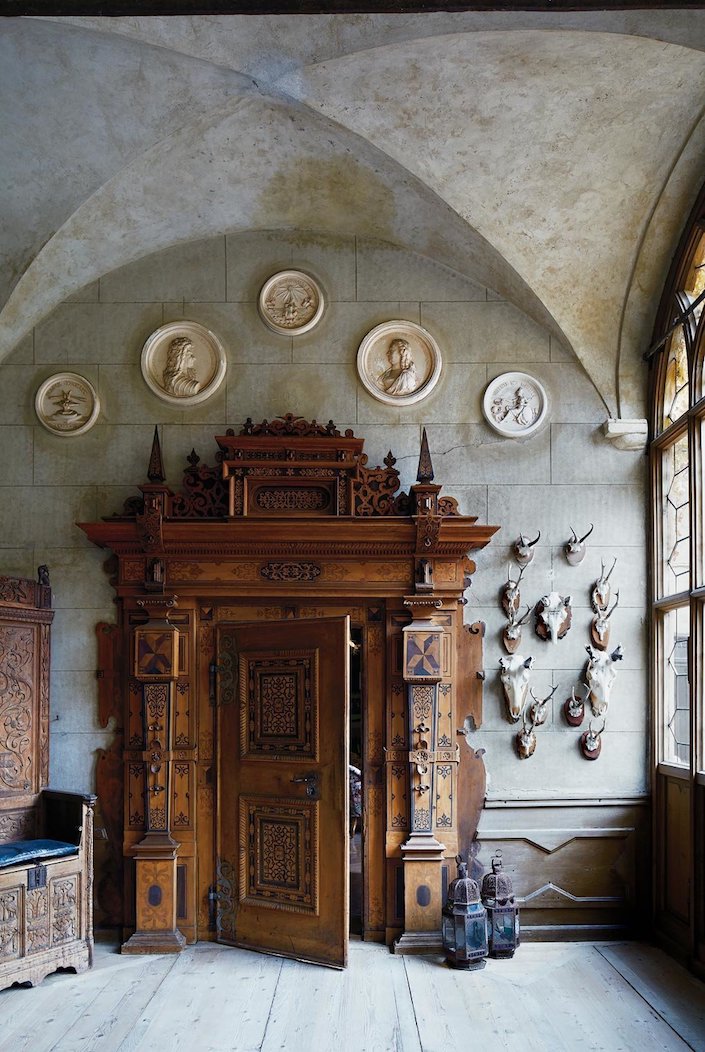 Schloss Hollenegg in Austria with 17th c. door and faux stone plaster, photo Simon Watson for T magazine