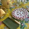 Amarilla tablecloth and Amethyst Daisy plates via Quintessence