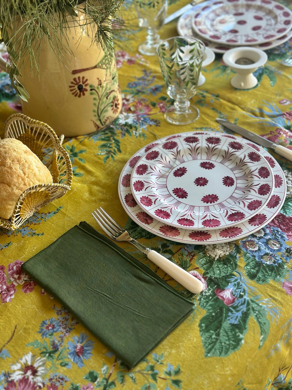 Amarilla tablecloth and Amethyst Daisy plates via Quintessence