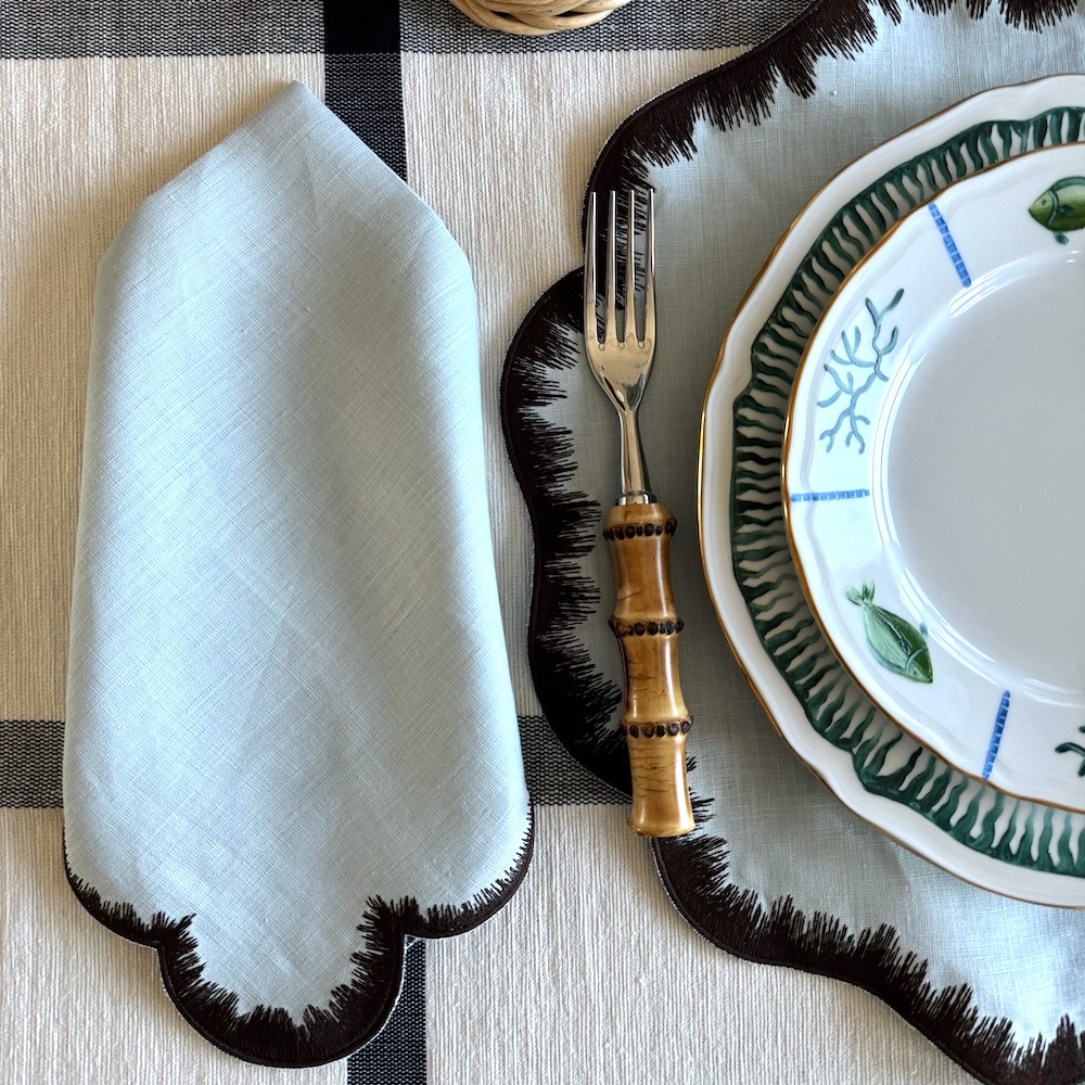 Feather napkin blue with brown via Quintessence