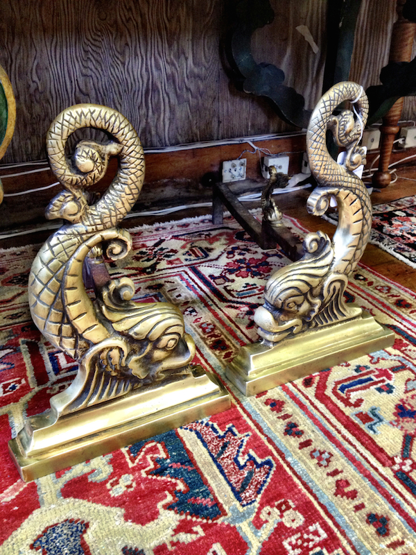 Vintage brass dolphin andirons at Rafael Osona auction