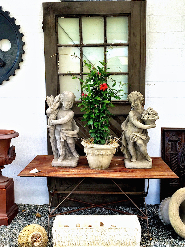 Urns and statuary at antique and artisan gallery